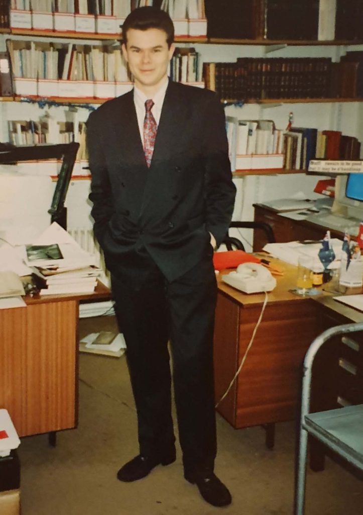 A young Ian Boulton at his desk in Stanley Gibbons aged 20 in 1990.